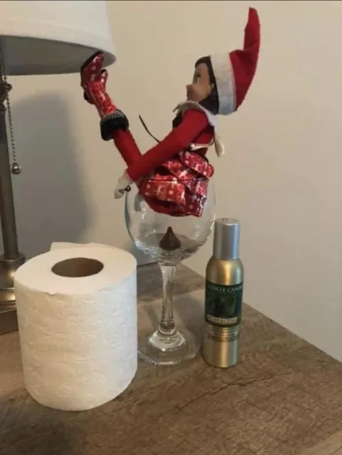 Elf doing a poo in a glass