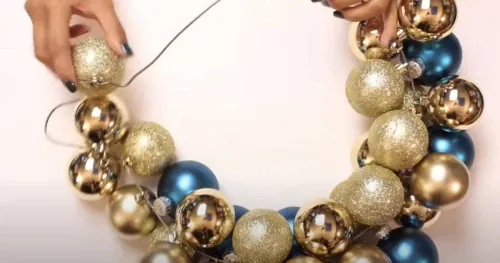 Got an old wire coat hanger? Use it to make a beautiful Christmas wreath