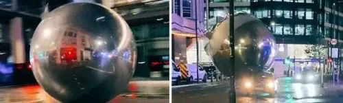 Out of control giant baubles seen rolling through Central London